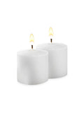 //www.yummicandles.ca/cdn/shop/products/21000-10hr-white-votive-candles-l_077bc080-315f-4190-b5a1-b1192816b41e_compact.jpg?v=1520245242